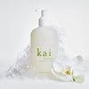 Kai Fragrance Hand Wash (12 oz) - product shown with suds and flower.
