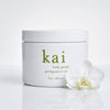Kai Fragrance Body Polish (8 oz) - product shown with a flower.
