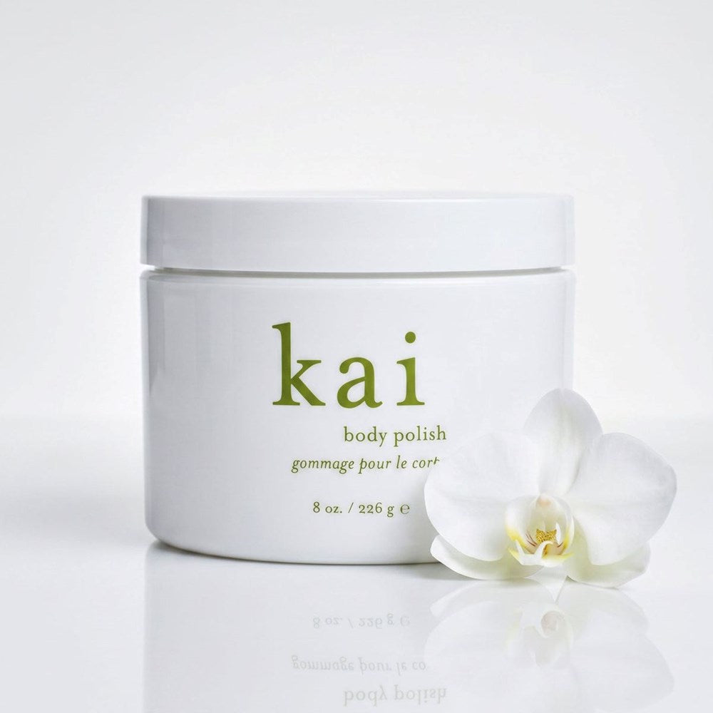 Kai Fragrance Body Polish (8 oz) - product shown with a flower.