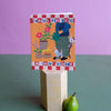 Small Adventure Great Neighbor Card (1 pc) - product shown on purple background with pear.