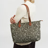 Fable England Edith Orla Scene Print Tote Bag - Khaki (1 pc) - product shown being held by model. 