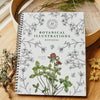 Herbal Academy Botanical Illustrations Workbook (1 pc) - product shown on wooden counters.
