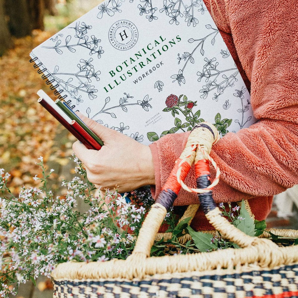 Herbal Academy Botanical Illustrations Workbook (1 pc) - product shown being carried