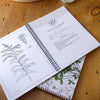 Herbal Academy Botanical Illustrations Workbook (1 pc) - product shown open. 