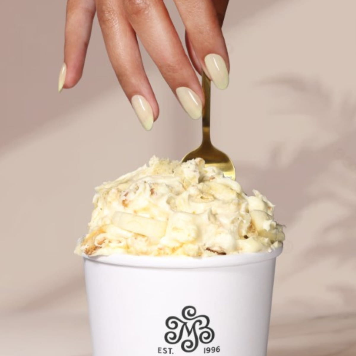 Londontown Magnolia Bakery x Londontown Nail Polish - Banana Pudding (12 ml) - product lifestyle shot. 