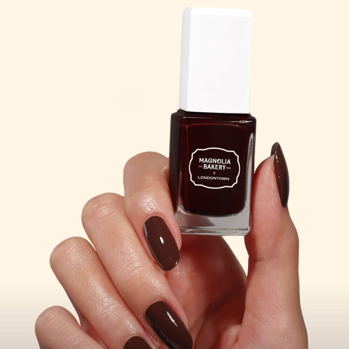 Londontown Magnolia Bakery x Londontown Nail Polish - Double Fudge (12 ml) - product shown being held. 