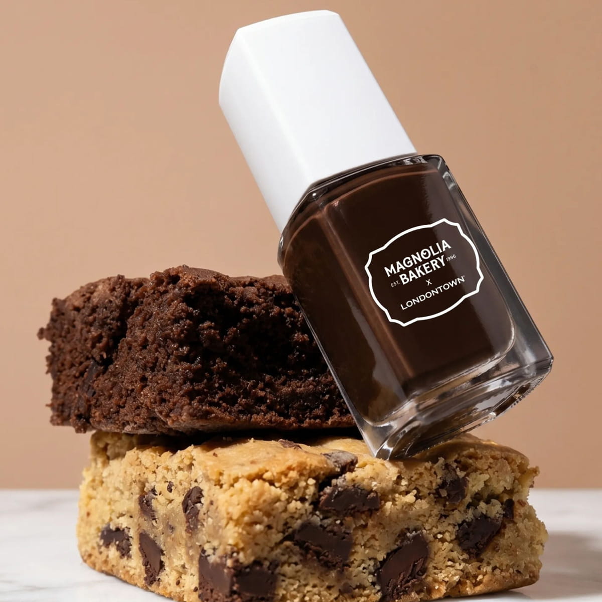 Londontown Magnolia Bakery x Londontown Nail Polish - Double Fudge (12 ml) - product shown next to cookie and brownie. 