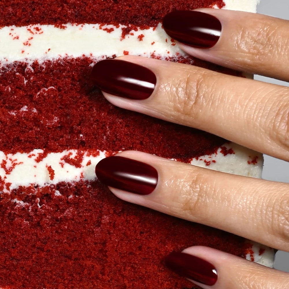 Londontown Magnolia Bakery x Londontown Nail Polish - Red Velvet (12 ml) - product shown next to cake. 