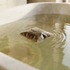 Mother Mother Organic Herbal Bath Tea (.5 oz) - product shown in bath tub.