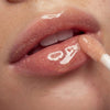 Nuxe Reve de Miel Gold Honey Lip Care (10 ml) - product shown applied on lips. 