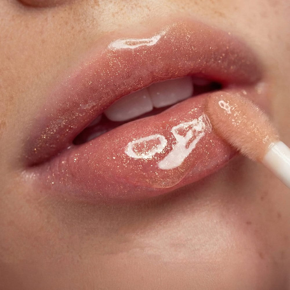 Nuxe Reve de Miel Gold Honey Lip Care (10 ml) - product shown applied on lips. 