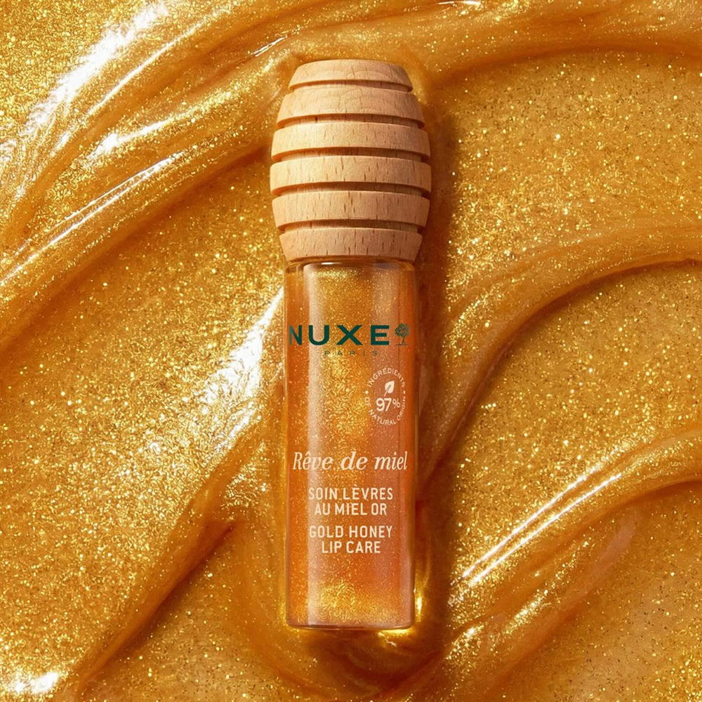 Nuxe Reve de Miel Gold Honey Lip Care (10 ml) - product shown on top of swatch. 