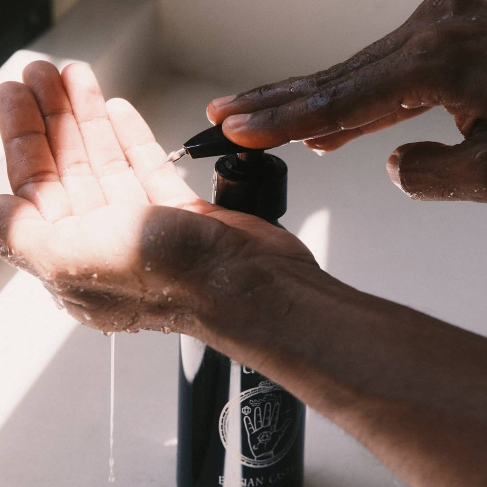 TUETAL Elysian Castile Liquid Soap (8.5 oz) - product shown being dispensed into hand. 