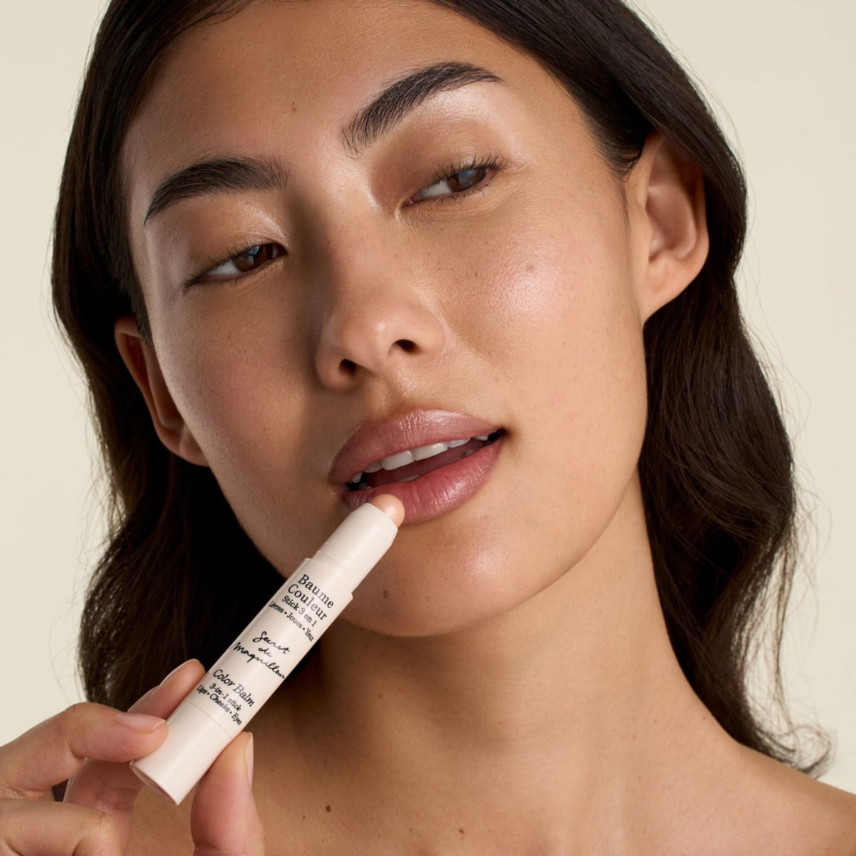 Embryolisse Color Balm 3-in-1 Stick - Champagne (2.5 g) - product shown on lips. 