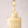 Kure Bazaar Nail Lacquer - Butter Cream (10 ml) - product shown with lid off.