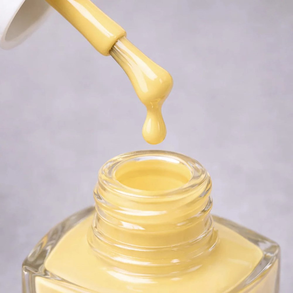 Kure Bazaar Nail Lacquer - Yellow Butter (10 ml) - product shown with lid removed.