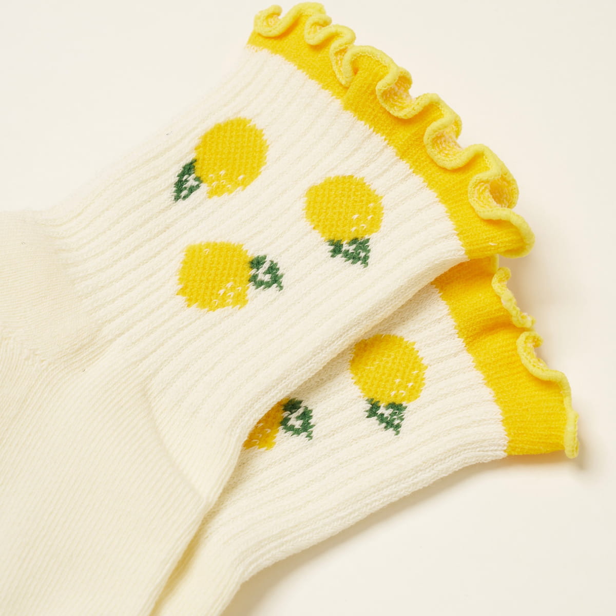 Effortless Club Lemon Ruffle Grip Sock (1 pair) - product shown close up. 