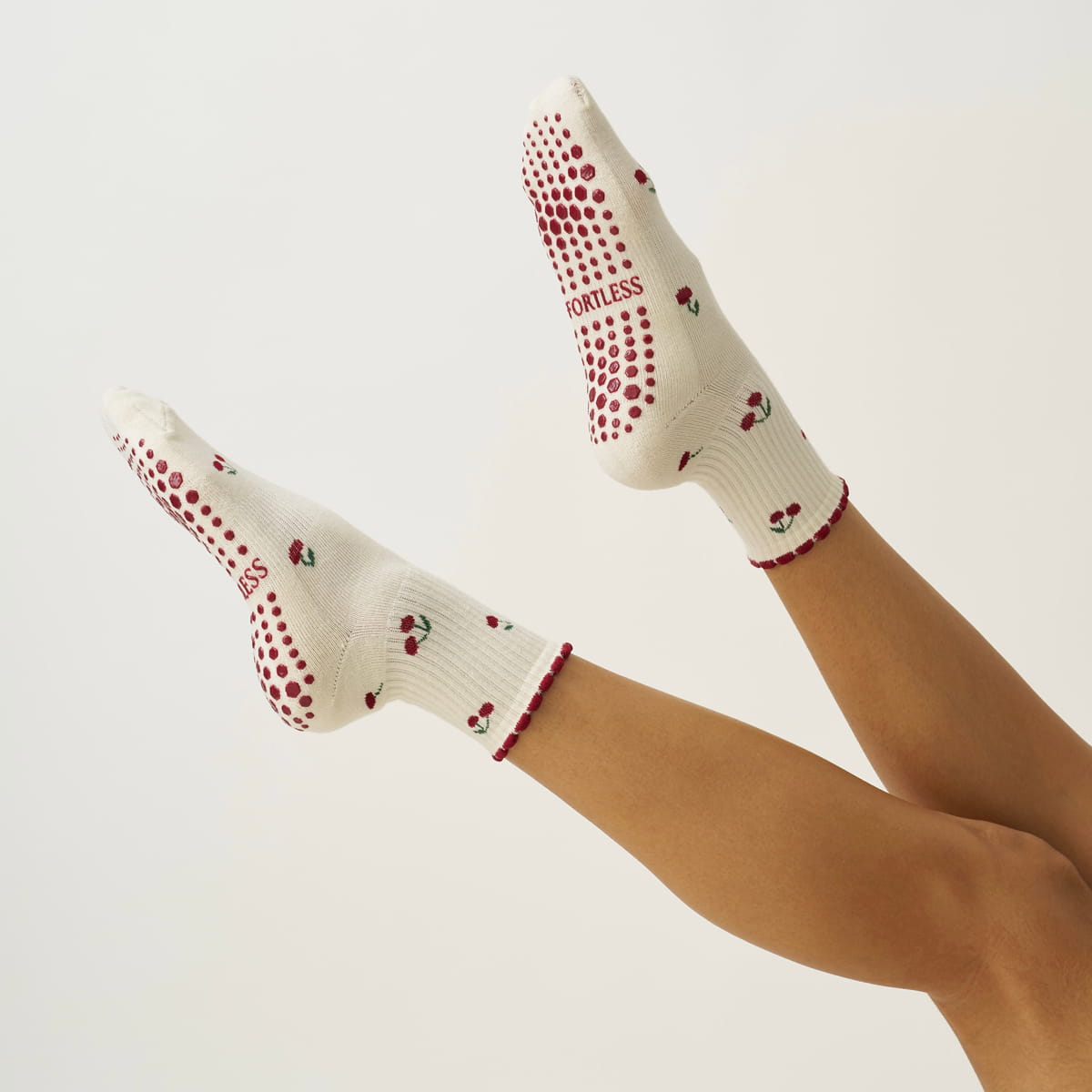 Effortless Club Little Cherry Petal Grip Sock (1 pair) - product shown on model's feet. 