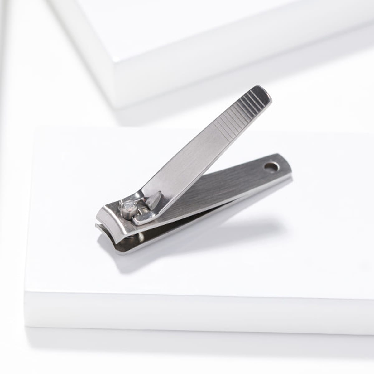 Tweezerman Stainless Steel Fingernail Clipper (1 pc) - product lifestyle shot. 