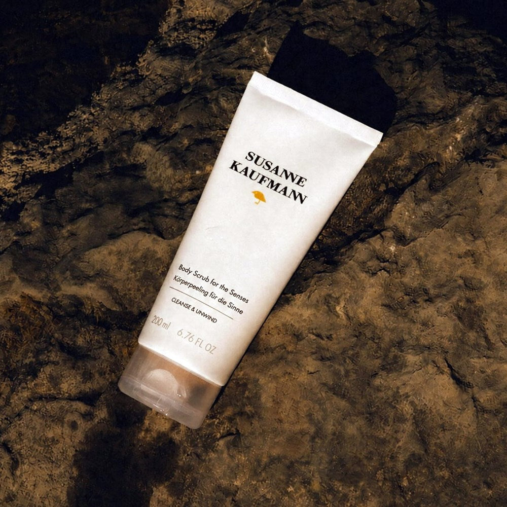 Susanne Kaufmann Body Scrub for the Senses (200 ml) - product shown on rock. 