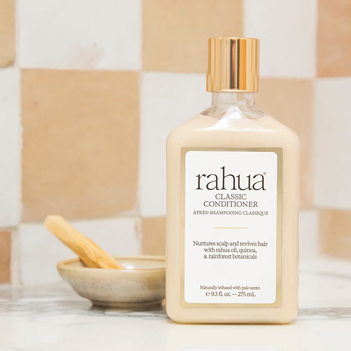 Rahua Classic Conditioner (275 ml) - product shown on counter top.