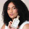 Rahua Classic Conditioner (275 ml) - model shown holding product.