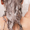 Rahua Hydration Shampoo (275 ml) - product shown lathered into hair.