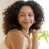 Rahua Hydration Shampoo (275 ml) - model shown. 