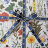 Botanica Paper Co. Stars Embroidered Ribbon (0.5” x 5 yards) shown wrapped on gift