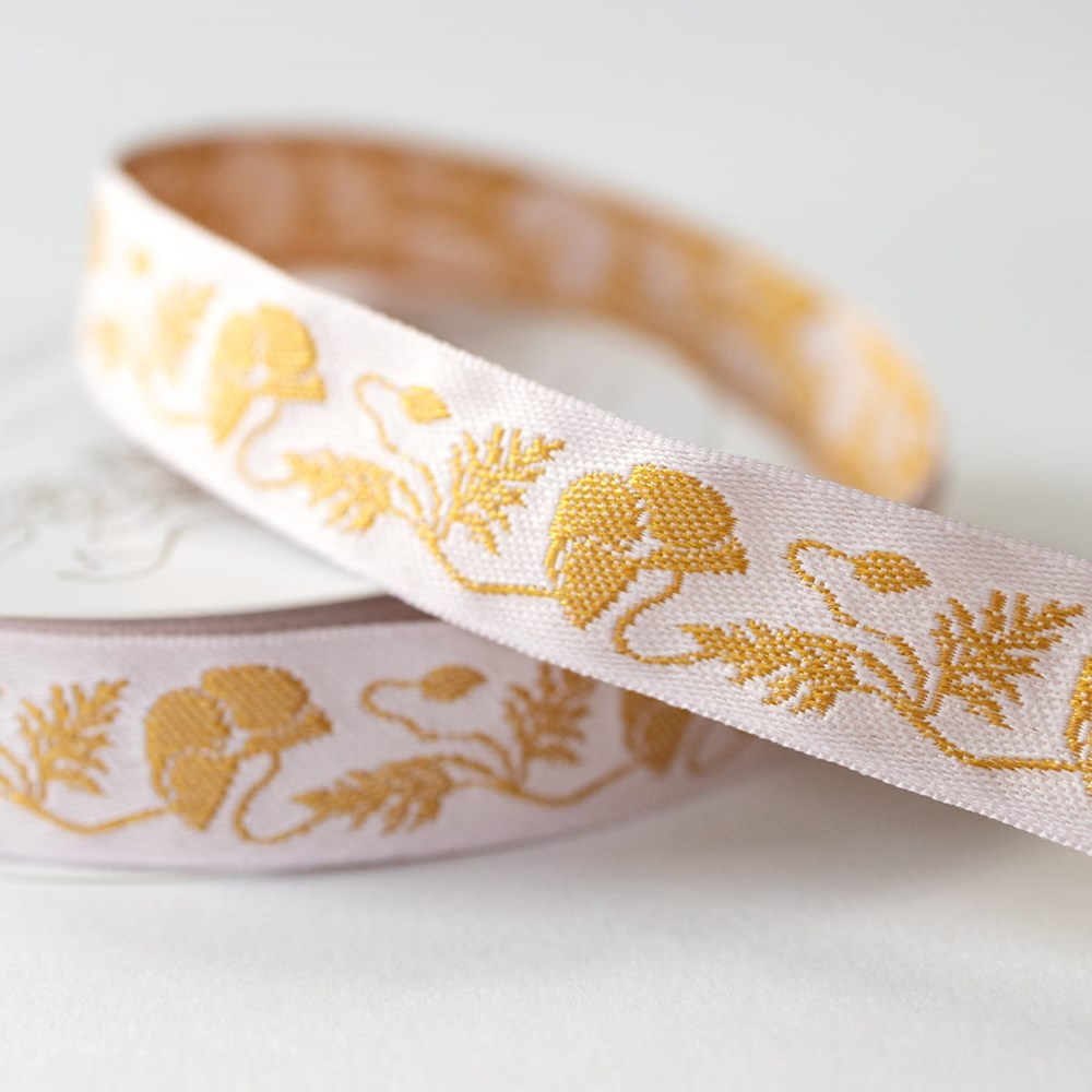 Close up detail of Botanica Paper Co. Gold Poppy Embroidered Ribbon (0.75” x 5 yards)
