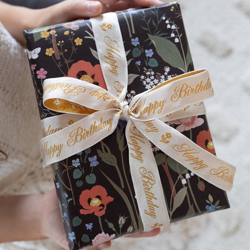 Botanica Paper Co. Happy Birthday Embroidered Ribbon shown on wrapped gift
