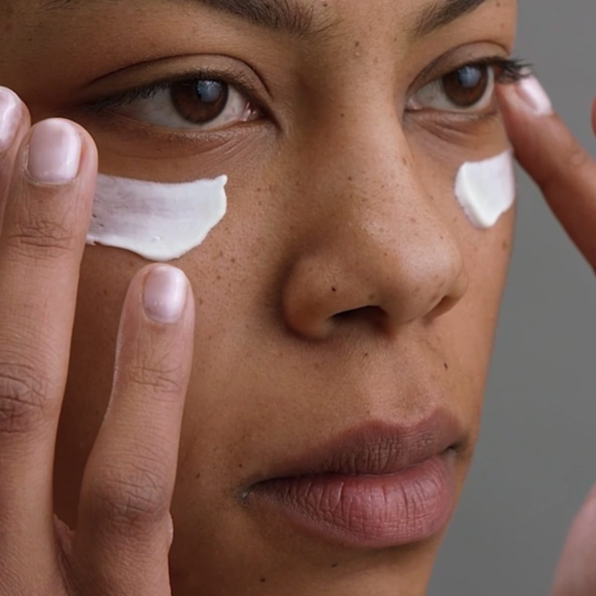 Susanne Kaufmann Nourishing Eye Cream (15 ml) - product shown being applied to model's eye.