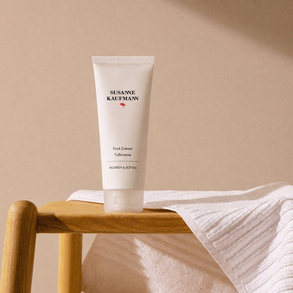 Susanne Kaufmann Foot Cream (100 ml) - product shown on wooden stool