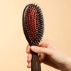L'Artisan Brossier Pure Boar & Nylon Bristle Brush - Large (1 pc) - product shown on creme. 