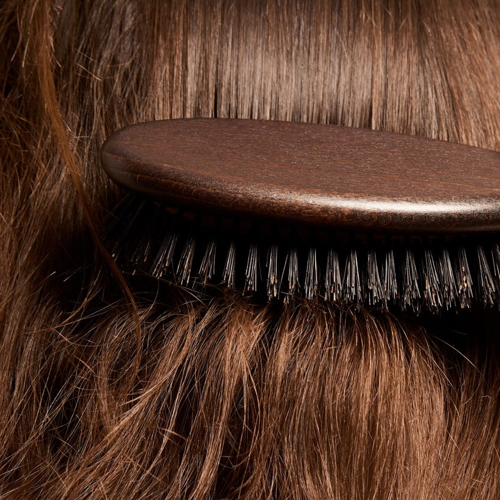 L'Artisan Brossier Pure Boar Bristle Brush - Large (1 pc) - products shown brushing hair.