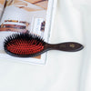 L'Artisan Brossier Pure Boar Bristle Brush - Large (1 pc) - product shown on white counter.