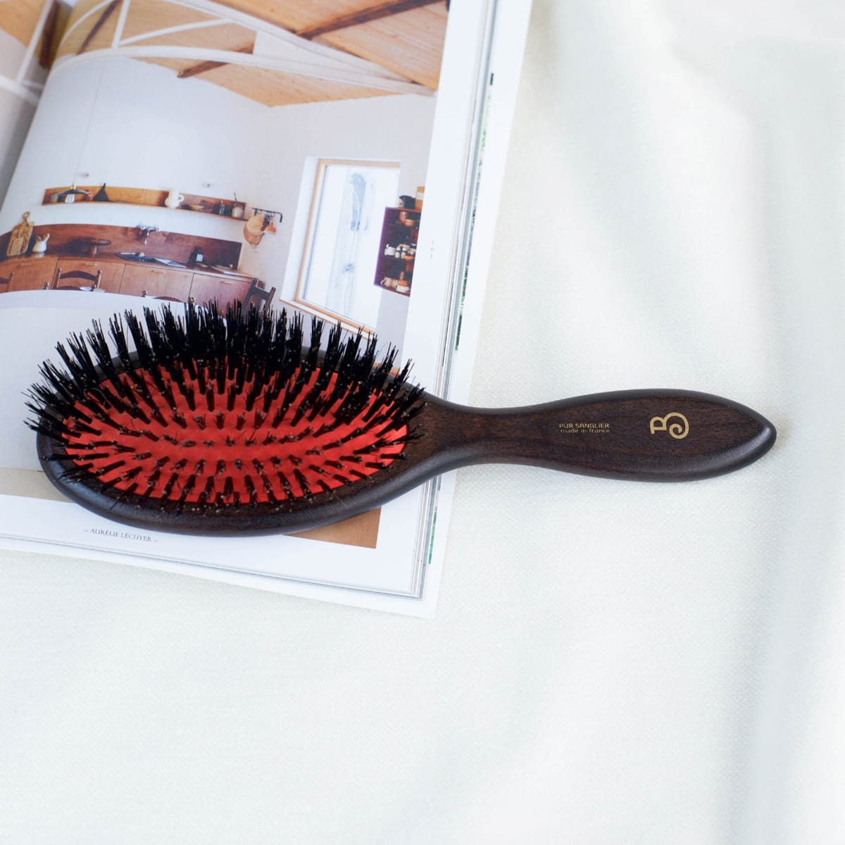 L'Artisan Brossier Pure Boar Bristle Brush - Large (1 pc) - product shown on white counter.