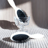 L'Artisan Brossier Bio-Based Nylon Bristle Brush - Medium (1 pc) - product shown on cloth.