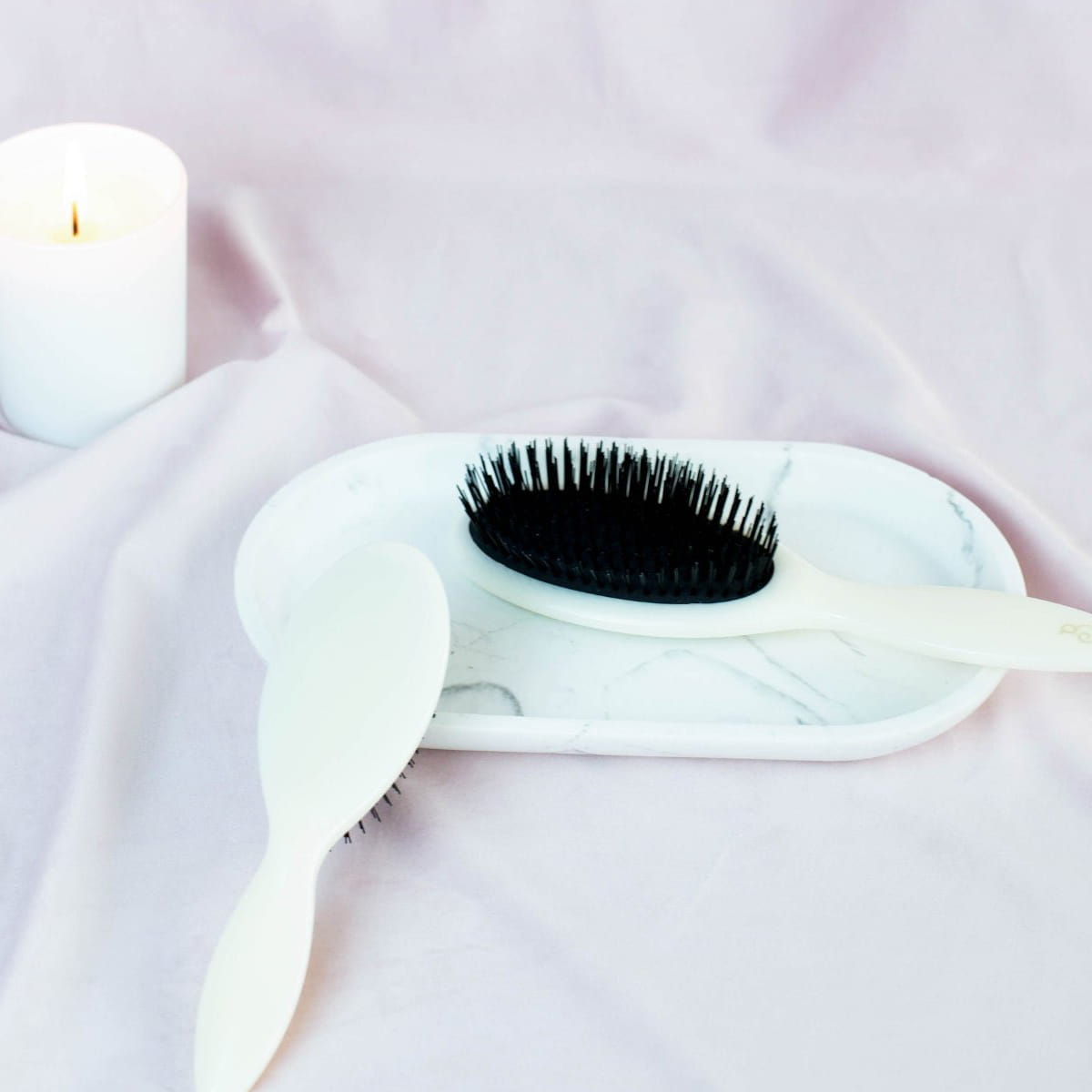 L'Artisan Brossier Bio-Based Nylon Bristle Brush - Medium (1 pc) - product shown on marble tray. 