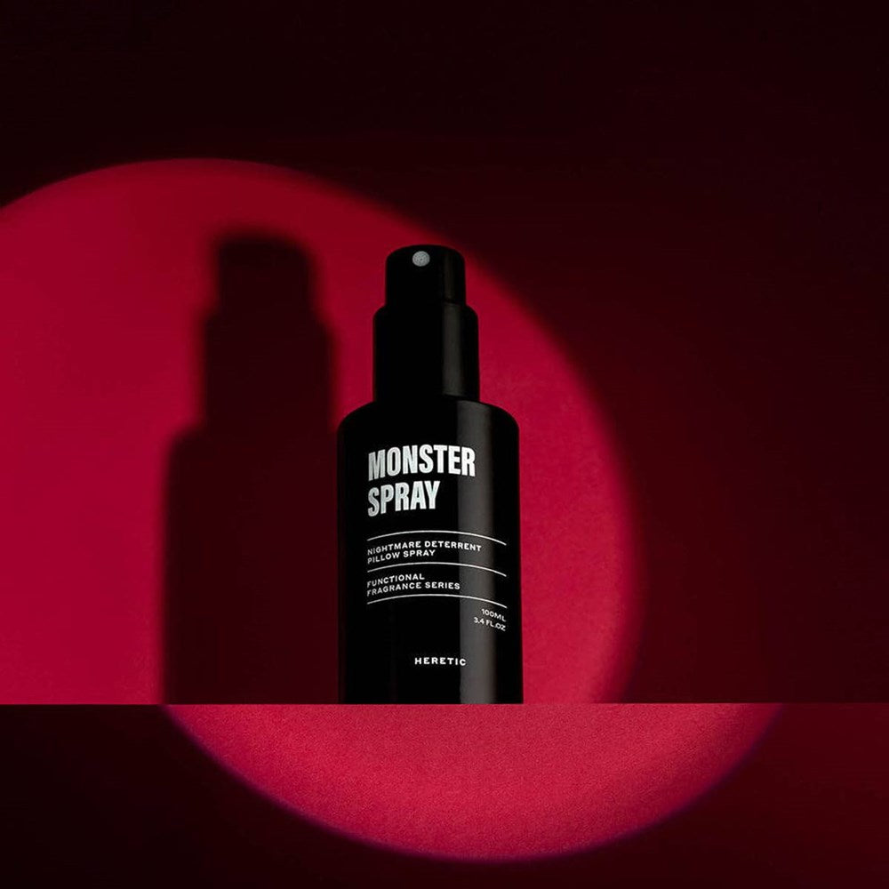 Heretic Parfum Monster Spray (100 ml) - product shown on red background.