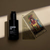 Heretic Parfum Divination Mist (100 ml) - product shown next to tarot cards. 