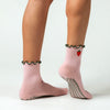 PikeFit Strawberry Shortcake Grip Socks shown on feet of model - available in S/M and M/L. One sock is shown from the side, the other showing the bottom of the foot.