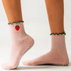 PikeFit Strawberry Shortcake Grip Socks shown on feet of model (side view) - Available in S/M and M/L