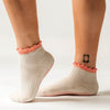 PikeFit Princess Grip Socks shown on feet of model (side view) - Available in S/M and M/L