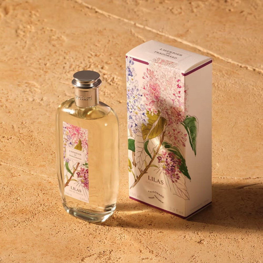 Fragonard Parfumeur Lilas (Lilac) Eau de Toilette (100 ml) - product shown on stone.