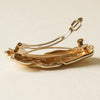 nar’sha Textured Metal Barrette Hair Clip - Gold shown from the back