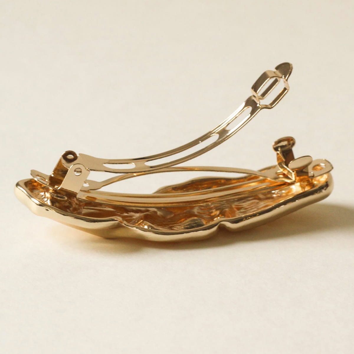 nar’sha Textured Metal Barrette Hair Clip - Gold shown from the back