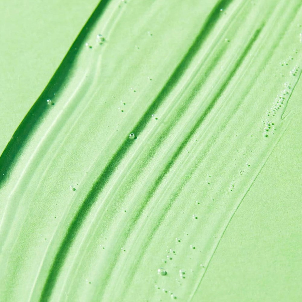 Nuxe Reve de The 24hr Fresh-Feel Deodorant product smear on green background