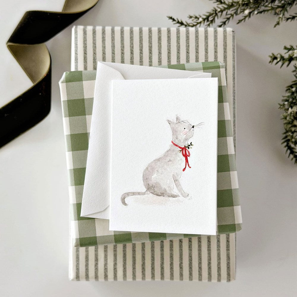 Emily Lex Studio Christmas Cat Mini Notecard displayed on top of a green and white striped gift box with a matching envelope