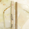 Even Keel Arbor Vitae Incense (60 sticks) shown on a white and beige marble background.